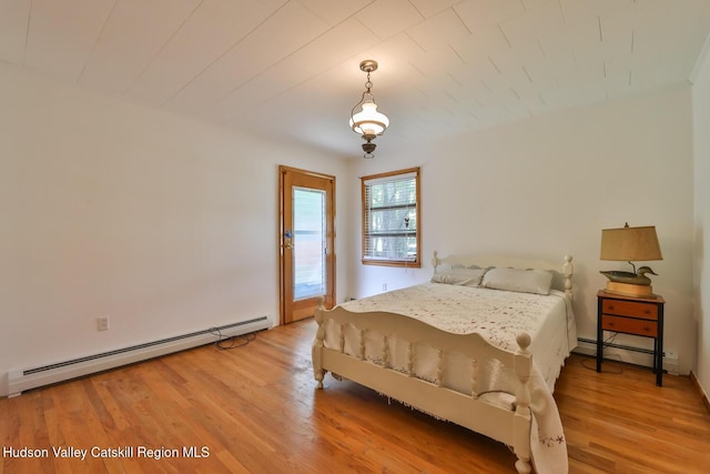18 Maplewood Ave, Windham, NY 12496 - bedroom featuring a baseboard heating unit and light wood-style floors