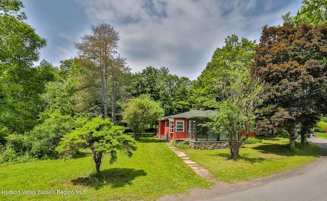 18 Maplewood Ave, Windham, NY 12496 - view of front of property featuring a front yard and a forest view