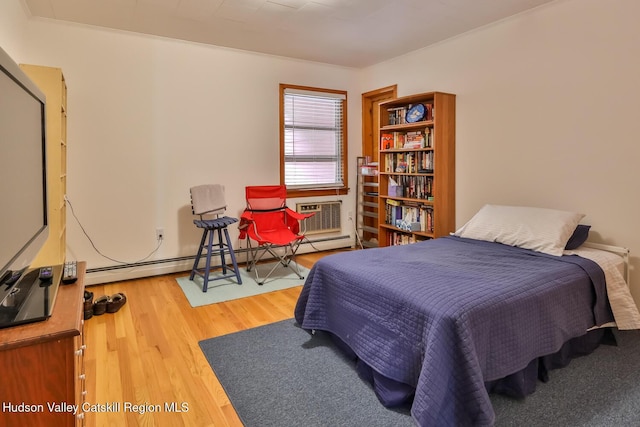 18 Maplewood Ave, Windham, NY 12496 - bedroom featuring a baseboard heating unit and wood finished floors