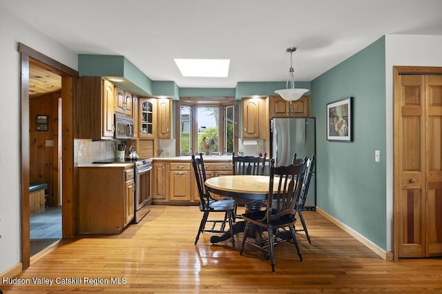 1024 Lakeview Rd, Copake, NY 12516 - dining space with a skylight and light wood-style floors