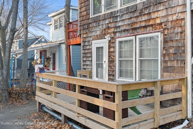 view of side of property with a wooden deck