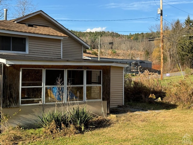 122 Bull Hill Rd, Conesville, NY 12076 - back of house with roof with shingles and a yard