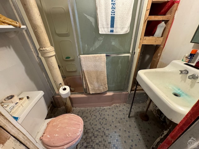 122 Bull Hill Rd, Conesville, NY 12076 - full bathroom featuring combined bath / shower with glass door, toilet, a sink, and tile patterned floors