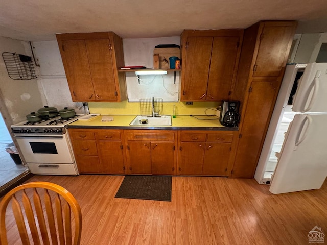 122 Bull Hill Rd, Conesville, NY 12076 - kitchen with white appliances, a sink, light wood finished floors, brown cabinetry, and open shelves