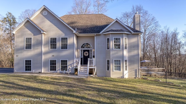 bi-level home with a front yard