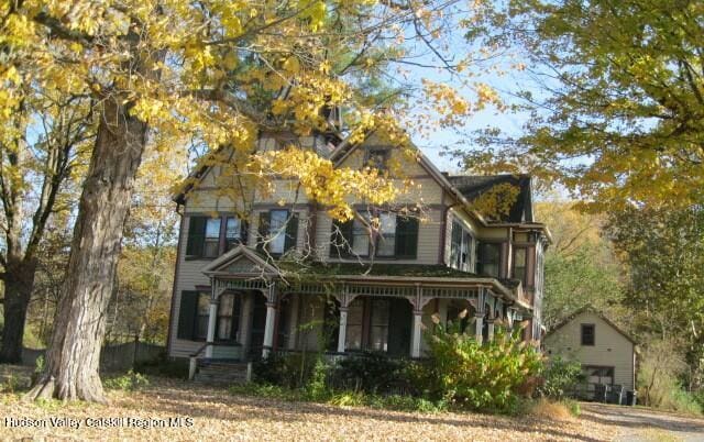 1896 County Rte 9, Chatham, NY 12037 - victorian home with a porch and an outdoor structure