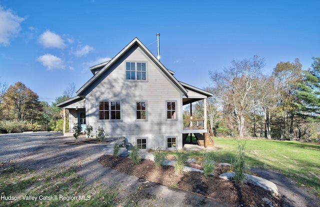 view of property exterior with a yard