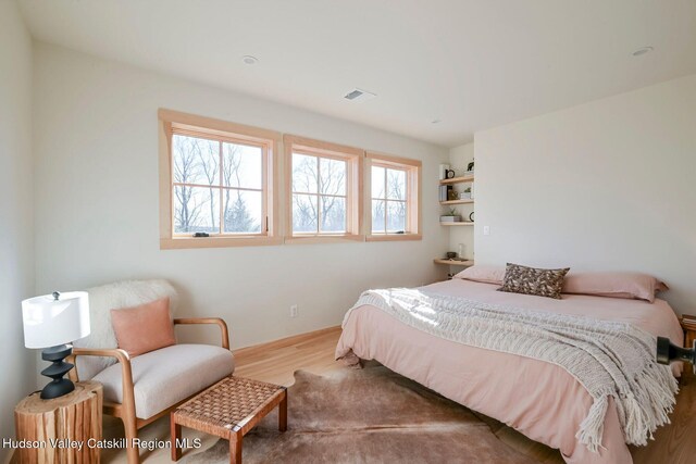 bedroom featuring hardwood / wood-style floors