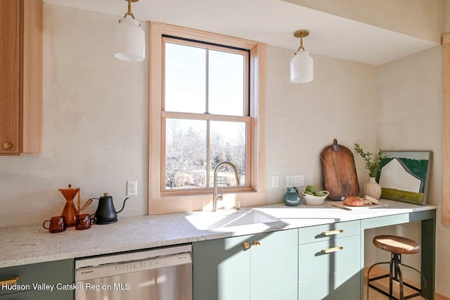 kitchen with pendant lighting, a healthy amount of sunlight, dishwasher, and green cabinets