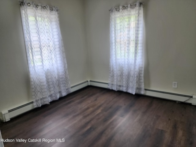 empty room featuring dark hardwood / wood-style flooring