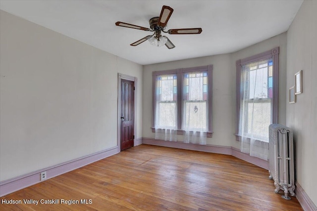 4930 State Route 81, Greenville, NY 12083 - empty room with radiator heating unit, plenty of natural light, light wood-style floors, and baseboards