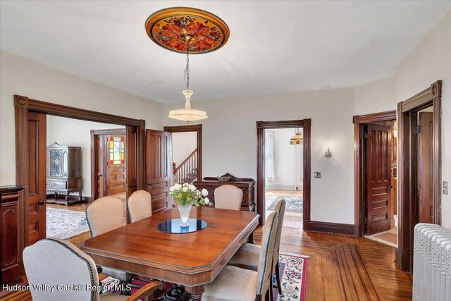 4930 State Route 81, Greenville, NY 12083 - dining room featuring stairs, baseboards, and radiator
