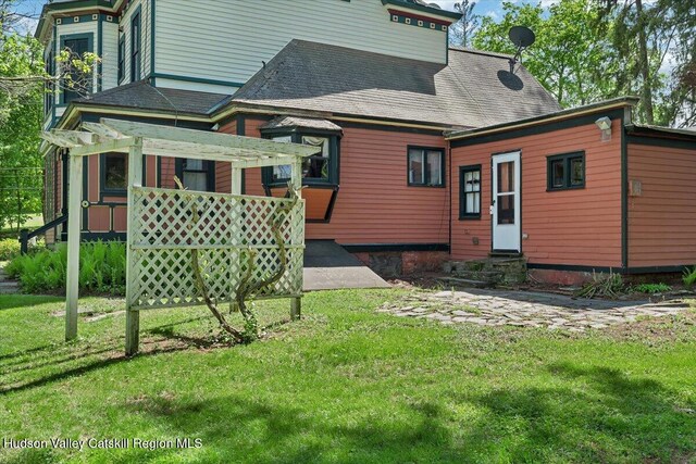 4930 State Route 81, Greenville, NY 12083 - rear view of property with entry steps, a yard, and roof with shingles