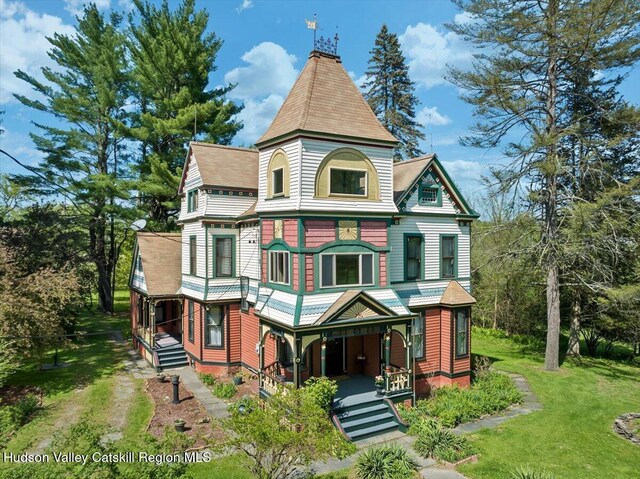 4930 State Route 81, Greenville, NY 12083 - victorian house featuring covered porch, a front yard, and roof with shingles
