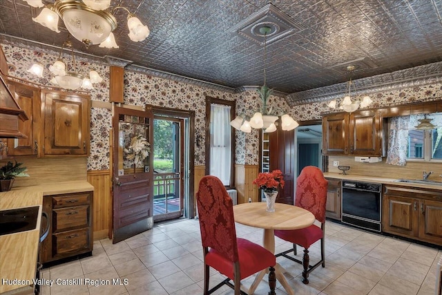 4930 State Route 81, Greenville, NY 12083 - dining room with a chandelier, wainscoting, an ornate ceiling, wallpapered walls, and light tile patterned flooring