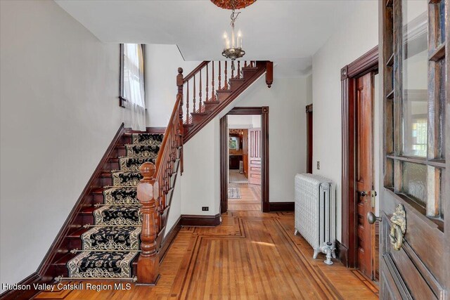 4930 State Route 81, Greenville, NY 12083 - stairs featuring radiator, wood finished floors, and healthy amount of natural light