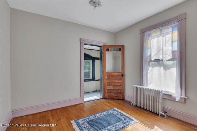 4930 State Route 81, Greenville, NY 12083 - bedroom featuring radiator, baseboards, and wood finished floors