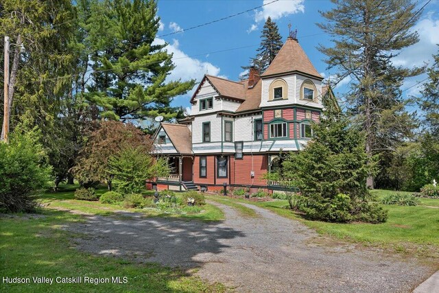 4930 State Route 81, Greenville, NY 12083 - victorian-style house with a chimney, a porch, a front yard, and dirt driveway