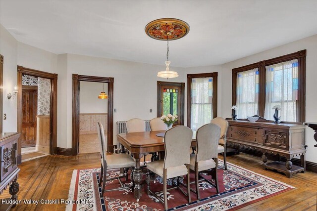 4930 State Route 81, Greenville, NY 12083 - dining space with wood-type flooring, baseboards, and wainscoting