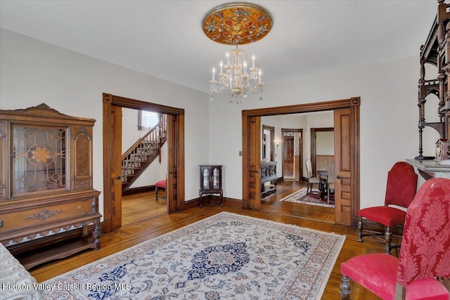 4930 State Route 81, Greenville, NY 12083 - sitting room with wood finished floors, a chandelier, stairway, and baseboards