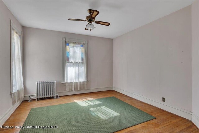 4930 State Route 81, Greenville, NY 12083 - spare room featuring radiator, healthy amount of natural light, and wood finished floors
