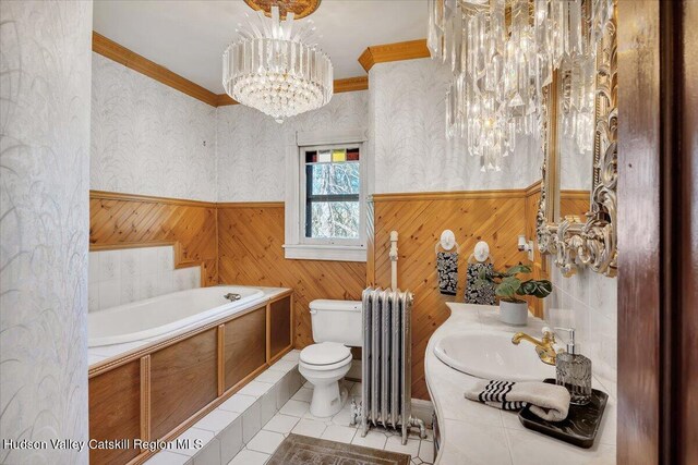 4930 State Route 81, Greenville, NY 12083 - bathroom with radiator, a chandelier, toilet, a wainscoted wall, and ornamental molding