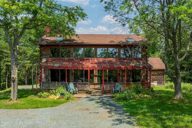 340 Lower Cady Rd, Old Chatham, NY 12136 - view of front facade featuring a front lawn, a chimney, log exterior, and a shingled roof