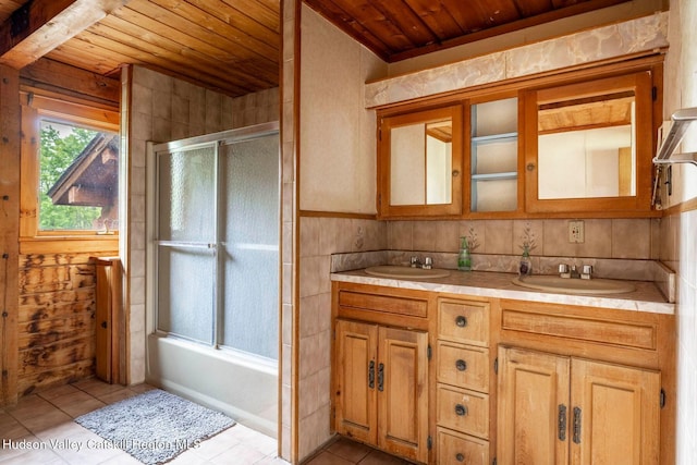 340 Lower Cady Rd, Old Chatham, NY 12136 - full bath with wood ceiling, tile patterned floors, double vanity, and bath / shower combo with glass door