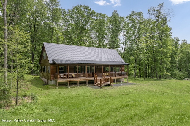 111 Ridgeway, Catskill, NY 12414 - rear view of property with a porch, a yard, log siding, and metal roof