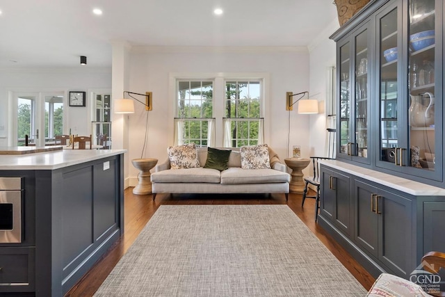 470 Harrington Dr, Austerlitz, NY 12017 - living area featuring dark wood finished floors, crown molding, healthy amount of natural light, and recessed lighting