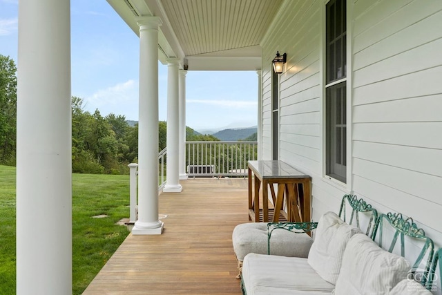 470 Harrington Dr, Austerlitz, NY 12017 - wooden deck with a porch, a lawn, and a mountain view