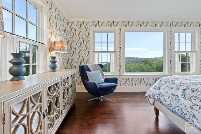 470 Harrington Dr, Austerlitz, NY 12017 - bedroom featuring wallpapered walls, dark wood-type flooring, baseboards, and crown molding