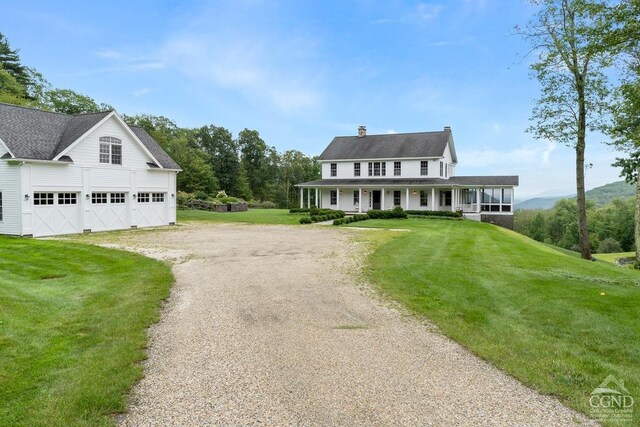 470 Harrington Dr, Austerlitz, NY 12017 - view of front facade with dirt driveway, covered porch, a front yard, and a chimney