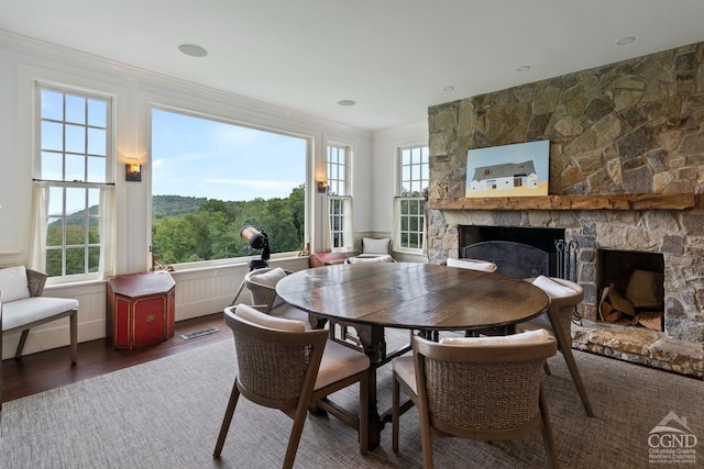 470 Harrington Dr, Austerlitz, NY 12017 - dining room featuring a fireplace, wood finished floors, and ornamental molding
