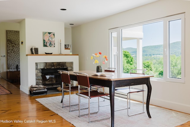 1114 County Route 3, Ancram, NY 12502 - dining space with wood finished floors and a fireplace