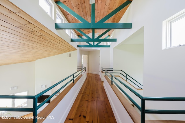1114 County Route 3, Ancram, NY 12502 - hallway with wooden ceiling, healthy amount of natural light, hardwood / wood-style floors, a high ceiling, and an upstairs landing