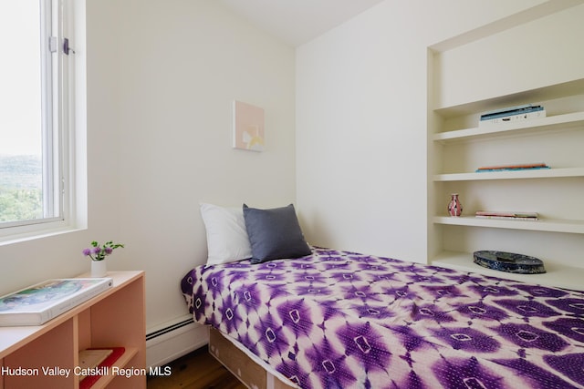 1114 County Route 3, Ancram, NY 12502 - bedroom with a baseboard heating unit and dark wood finished floors
