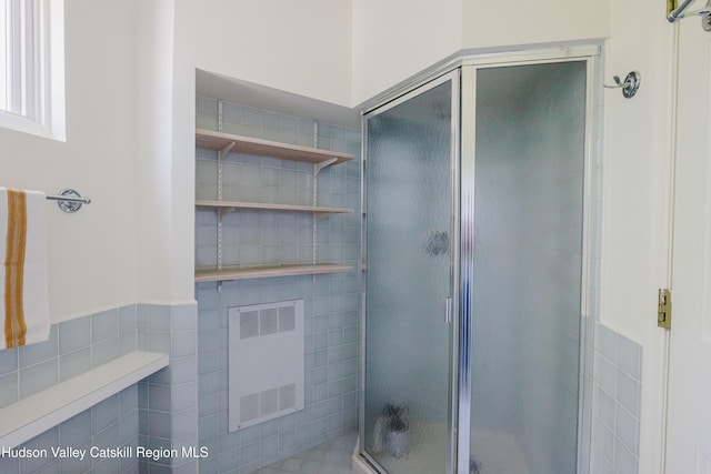 1114 County Route 3, Ancram, NY 12502 - full bathroom with radiator, a shower stall, and tile walls