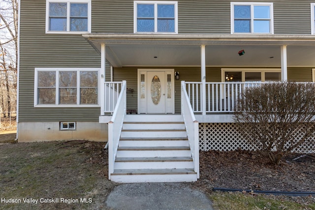 doorway to property with covered porch