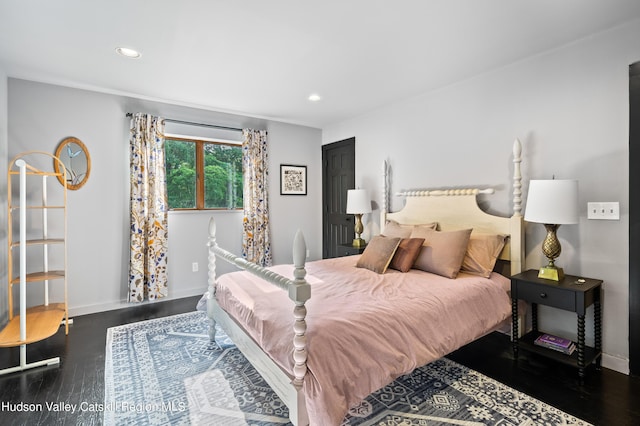bedroom featuring dark hardwood / wood-style flooring