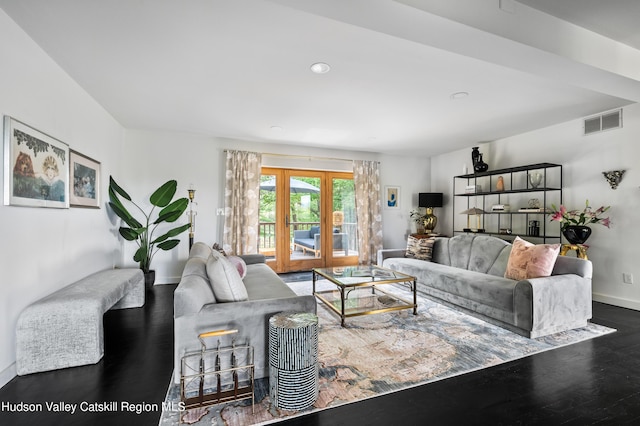 living room with dark hardwood / wood-style flooring and french doors