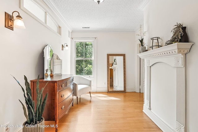 125 Bedell Rd, Poughkeepsie Town, NY 12603 - hallway featuring light wood finished floors, crown molding, and a textured ceiling