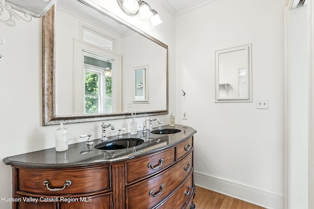 125 Bedell Rd, Poughkeepsie Town, NY 12603 - bathroom with double vanity, wood finished floors, and ornamental molding