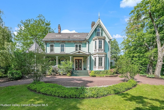125 Bedell Rd, Poughkeepsie Town, NY 12603 - victorian home featuring covered porch, a chimney, french doors, and a front yard