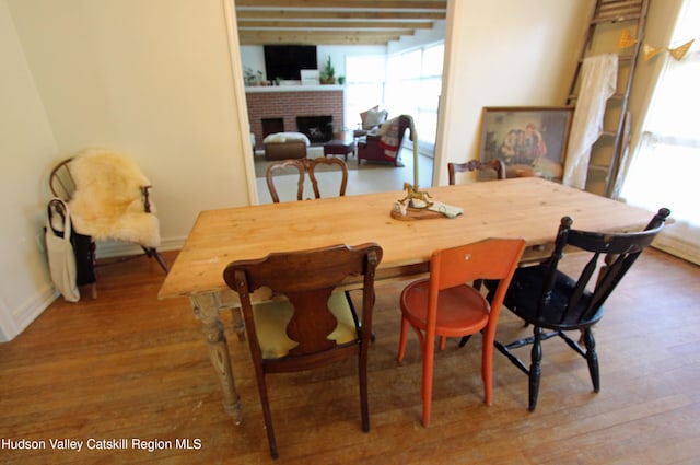 171 State Route 208, New Paltz, NY 12561 - dining space with wood finished floors, baseboards, and a fireplace