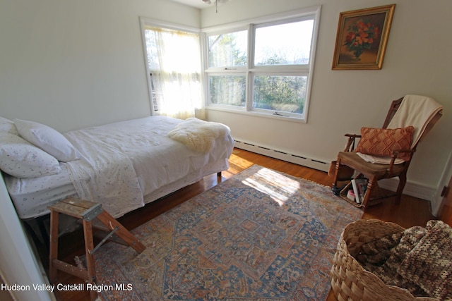 171 State Route 208, New Paltz, NY 12561 - bedroom featuring baseboard heating and wood finished floors