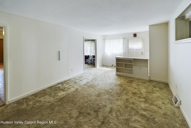 empty room featuring carpet floors