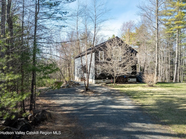 exterior space featuring dirt driveway