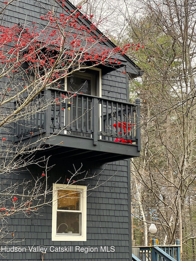 view of property exterior featuring a balcony