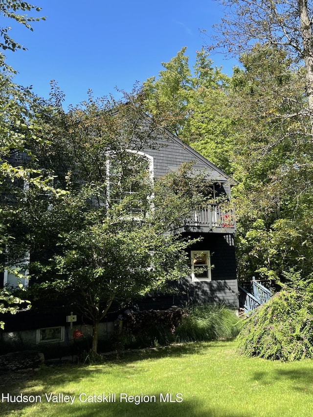 view of home's exterior featuring a yard